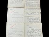 four old papers with handwriting on them sitting on top of a table