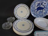 many plates and bowls that are sitting on a table