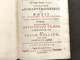 a book open on a table with a black background
