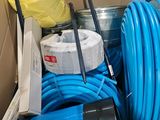 a box full of blue hoses and a yellow bucket