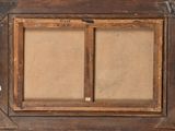 an old picture frame with a picture of a man and a woman