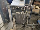 a machine that is sitting on the ground in the garage