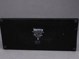 a close up of a black box on a gray surface