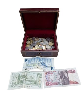 a wooden box filled with money and coins on a white background