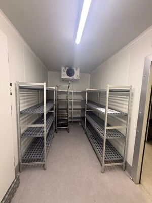 a long room with a lot of shelves in it