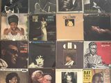 a lot of records on the wall of a room