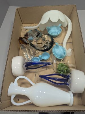 a box with a variety of glass items inside of it