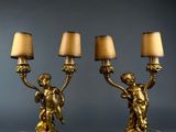 a pair of antique brass table lamps with cher chers