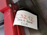 a sign on the side of a red door that says 2232