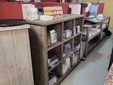 a desk with a bunch of books on it in a room