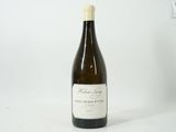 a bottle of wine that is sitting on a table