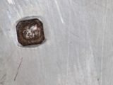 a piece of metal that has a hole in it