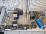 many boxes of different types of metal wire on a shelf