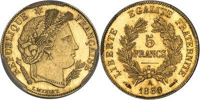 a gold coin with a woman ' s head on it