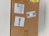 a cardboard box with some stickers on it sitting on a table