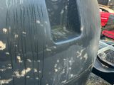 an image of a large black tank with a hole in it