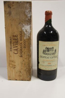 a bottle of wine sitting next to a box of wine