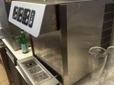 a machine that is sitting on a counter in a kitchen