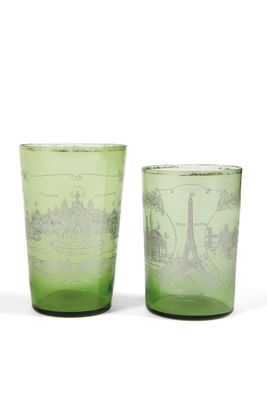 pair of green glass tumblers with a picture of a city on them