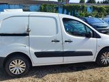a small white van parked in a parking lot