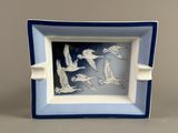 a picture of a blue and white plate with birds on it