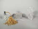 three glass objects that are sitting on a table