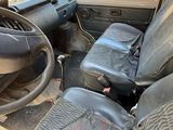an image of a car with a steering wheel and seat covers
