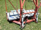 a small machine that is sitting in the grass
