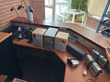 an image of a desk with a lot of electronics on it