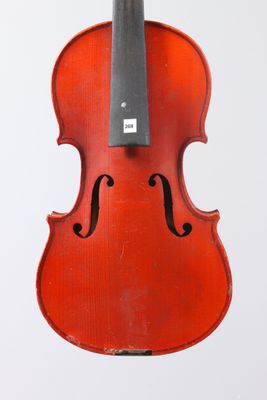an old violin with a bow hanging from it ' s back