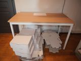 a pile of boxes sitting on top of a table