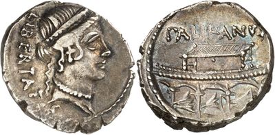 a silver coin with an image of a woman on it
