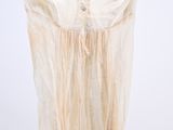 an image of a dress hanging on a hanger on a white wall