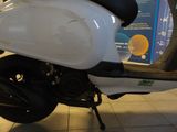 a scooter that is sitting on the floor in a building