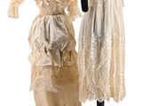 two dresses on mannequins on display on a white background