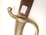 a close up of a sword with a sticker on it