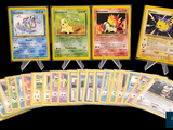 several pokemon cards are lined up in a row on a black background