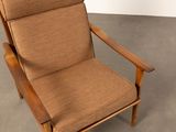 an image of a chair with a brown upholstered seat