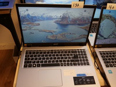three laptops that are sitting on a table