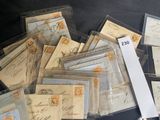 a pile of old letters and envelopes sitting on a table