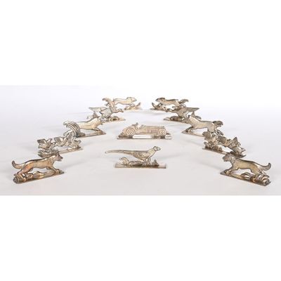 an image of a group of silver figurines of animals
