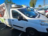 a white van that is parked in a parking lot