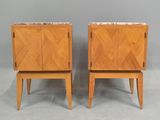 a pair of mid century style nightstands with marble top