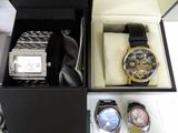 two watches in a box with a watch in it