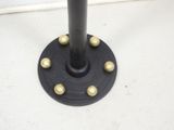 a black pole with gold balls on it