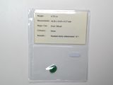 a picture of a piece of green glass with a note attached to it
