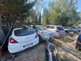 many cars parked in a parking lot next to each other
