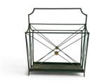a green metal magazine rack with a wooden shelf underneath it