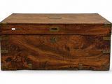 a small wooden box with a metal latch on it