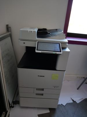 a white printer sitting on top of a black and white printer